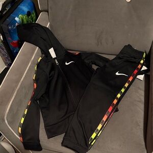 Nike Kids Black Jogger Set with Yellow-Red Gradient Stripes
